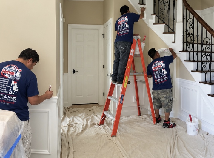 Entryway and staircase painting with floors fully protected